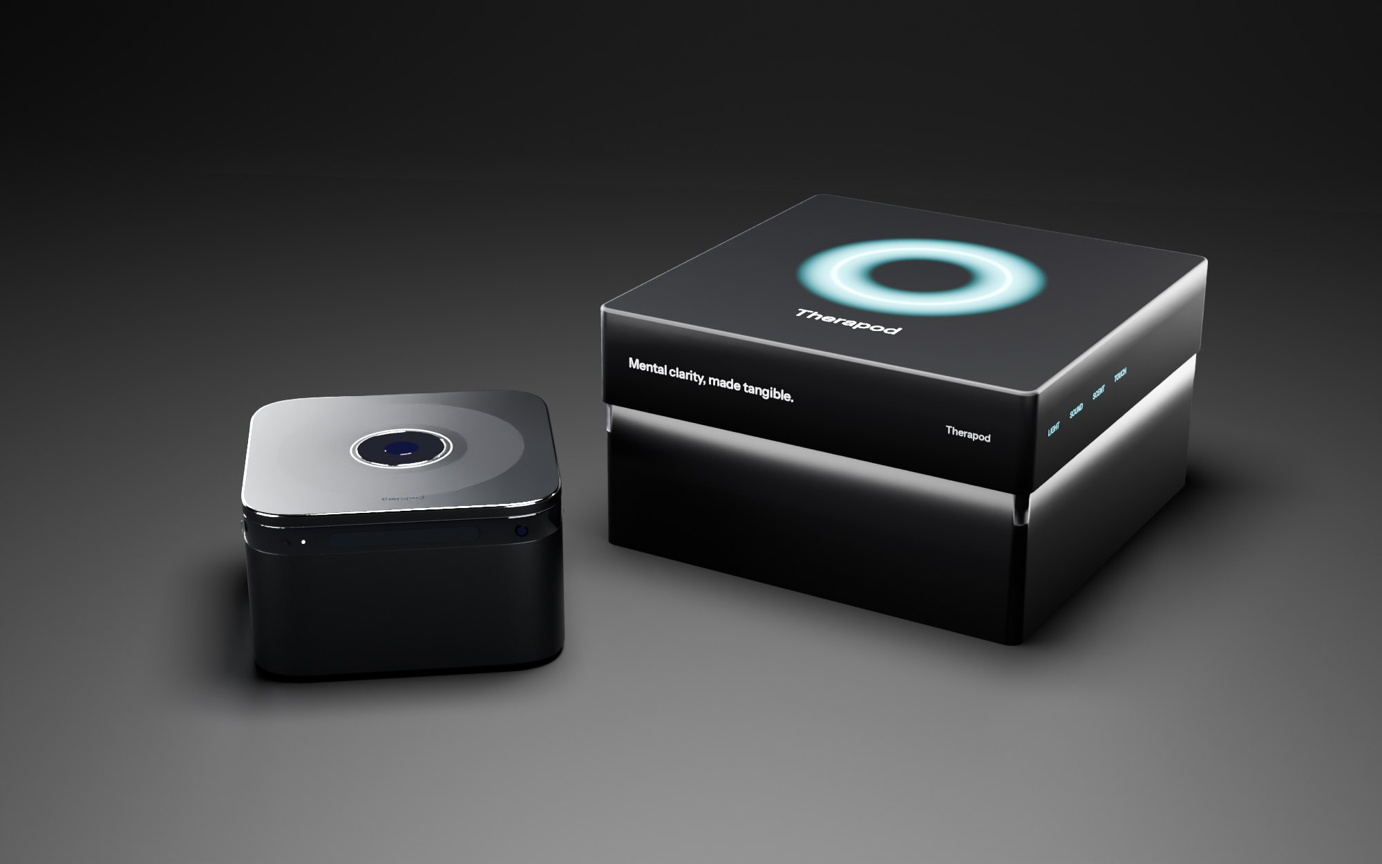A soft-touch black box with a glowing aurora ring on the lid, next to Therapod in Black Titanium